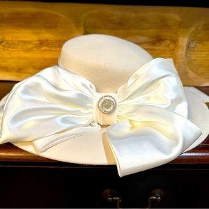 Homecoming court hat with added broach.